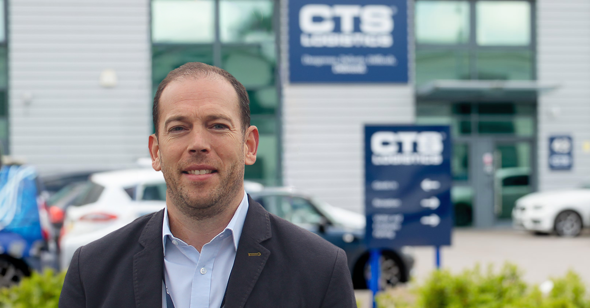Bright head and shoulders photo of Jonathan Monks CTS Logistics Regional Director in front of CTS head office